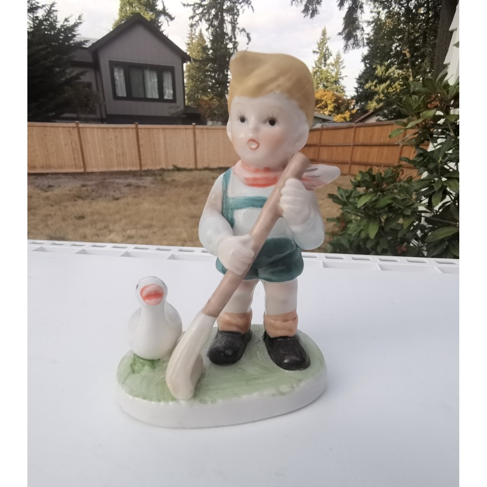 Flambro collectors choice Series , boy w/ present & duck figurine